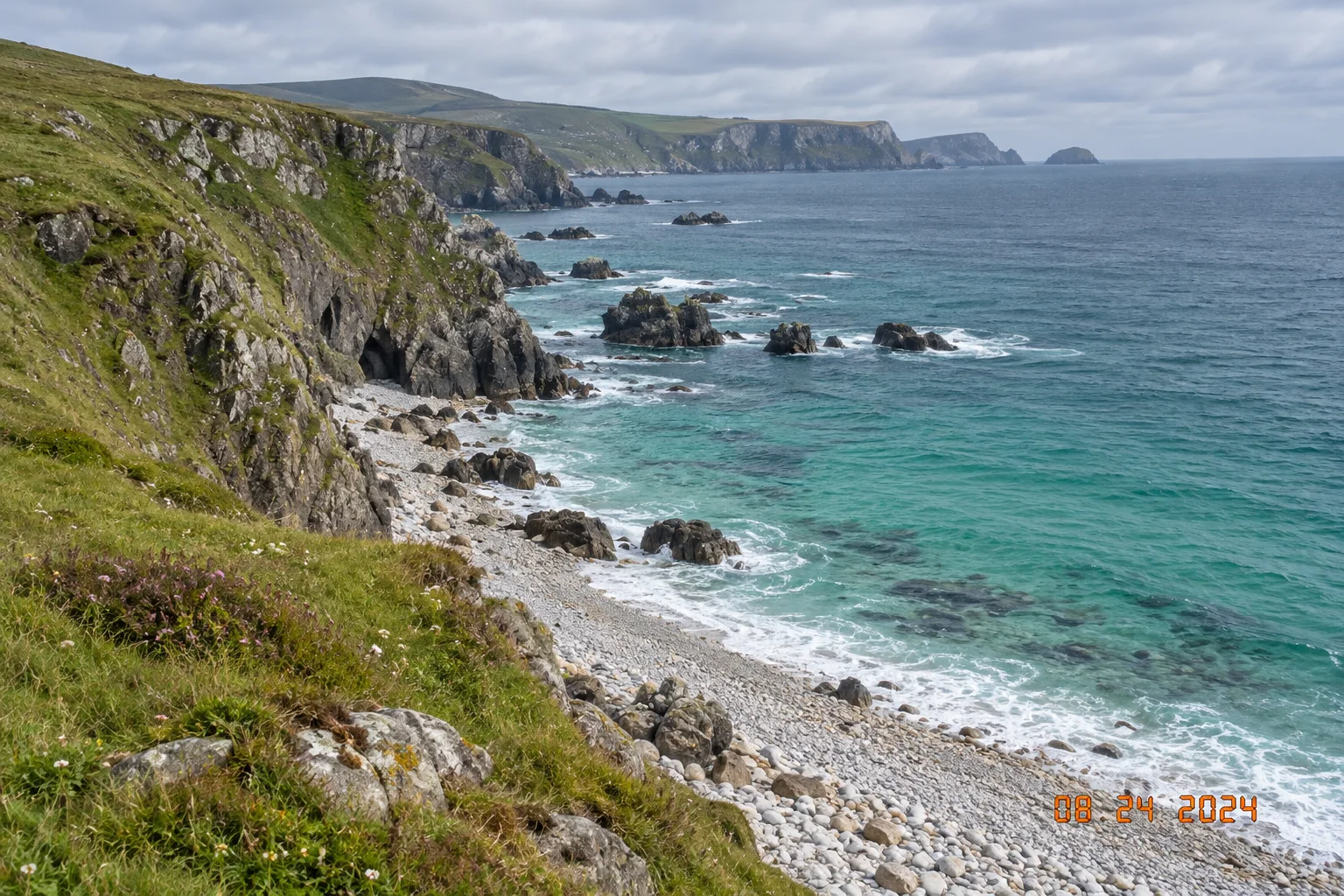 Coastal landscape with an orange camera date stamp removed before editing